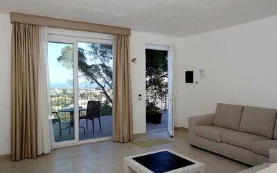 Villa Aurora: Furniture, Couch, Comfort, Wood, Interior Design, Living Room, Floor, Shade, Studio Couch