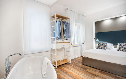 Luxury Blues Apartment: Bathtub, Building, Comfort, Wood, Floor, Bed Frame, Flooring, Door, Cabinetry