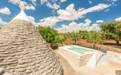 Trullo Del Pioppo Gigante: Cloud, Sky, Thatching, Plant, Tree, House, Landscape, Swimming Pool, Grass, Natural Landscape