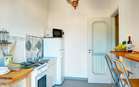 Parsano Home: Property, Cabinetry, Furniture, Blue, Kitchen, Countertop, Home Appliance, Lighting, Orange, Kitchen Appliance