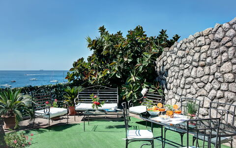 La Baia Dello Chalet: Sky, Plant, Property, Water, Furniture, Table, Nature, Chair, Outdoor Furniture, Shade