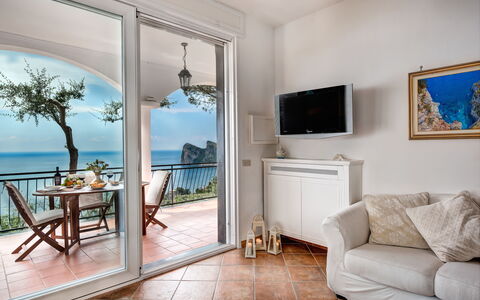 Medusa And The Seahorse Villa: Picture Frame, Furniture, Property, Table, Blue, Green, Couch, Interior Design, Wood, Comfort