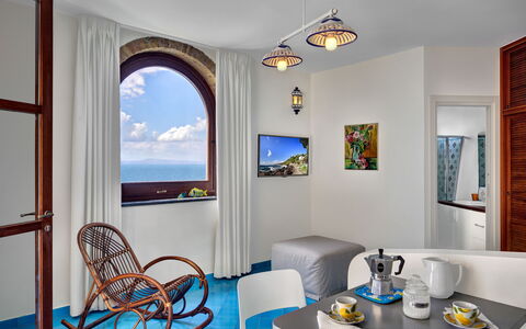 Appartamento Lobra: Furniture, Property, Picture Frame, Tableware, Blue, Table, Azure, Lighting, Interior Design, Wood