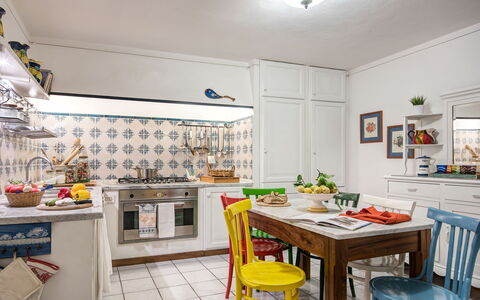 Country Lemonvilla: Table, Cabinetry, Property, Furniture, Countertop, Kitchen, Lighting, Interior Design, Orange, Flooring