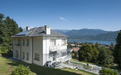 Villa Ermelinda: Sky, Plant, Property, Building, Water, Tree, Cloud, Window, Mountain, Residential Area