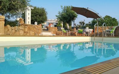 Villa Giunone: Swimming Pool, Property, Water, Real Estate, Umbrella, Azure, Aqua, Reflection, Resort, Shade