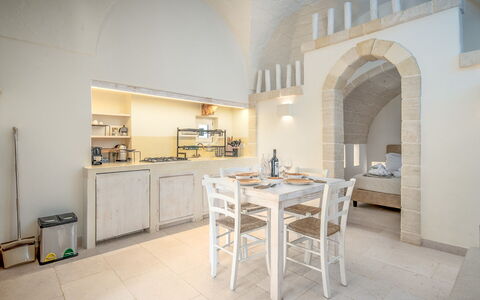 La Torretta - Corte dei Messapi: Furniture, Table, Cabinetry, Countertop, Kitchen, Wood, Building, Chair, House, Interior Design