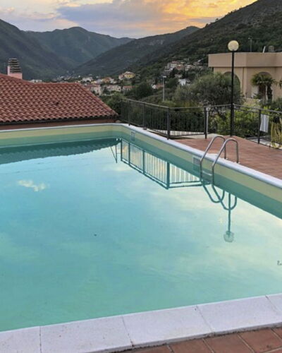 Dada: Water, Building, Cloud, Property, Swimming Pool, Sky, Plant, Nature, Azure, Shade