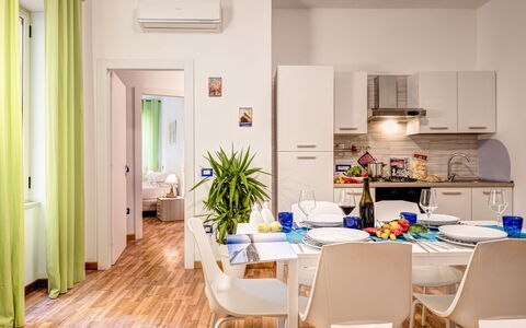 Living Times Apartment: Property, Furniture, Table, Chair, Cabinetry, Plant, Interior Design, Wood, Houseplant, Flooring