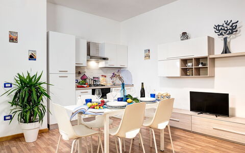 Living Times Apartment: Table, Property, Plant, Furniture, Couch, Building, Interior Design, Wood, Chair, Flowerpot