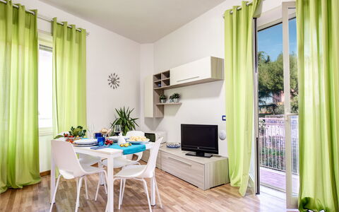 Loving Times Apartment: Plant, Property, Furniture, Window, Couch, Green, Table, Azure, Wood, Interior Design