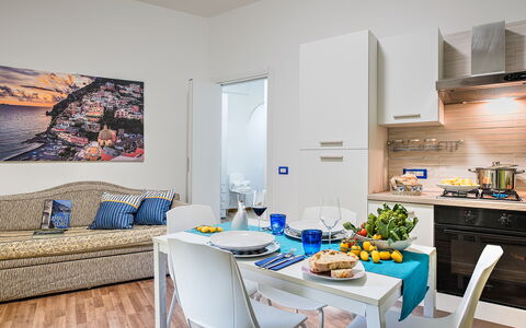 Loving Times Apartment: Table, Property, Furniture, Food, Azure, Tableware, Couch, Interior Design, Wood, Living Room