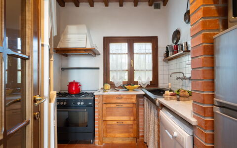 Villa Elisa: Kitchen, Furniture, Cabinetry, Countertop, Interior Design, Flooring, Wood, Kitchen Appliance, Major Appliance, Kitchen Sink