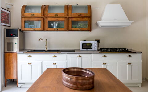 Villa Oria: Brown, Cabinetry, Countertop, Furniture, Property, Building, Drawer, Kitchen Stove, Kitchen, Wood