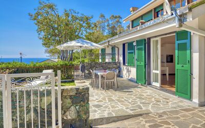 Marlà - Levanto: Sky, Property, Table, Plant, Building, Azure, Shade, Flowerpot, Door, Chair