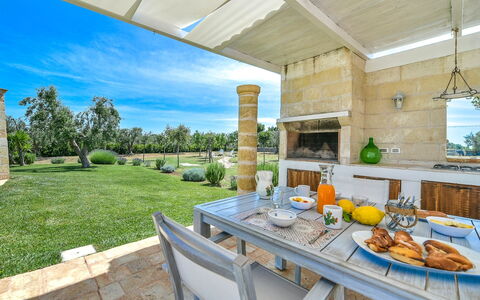 Villa Ofelia: Plant, Table, Property, Furniture, Tableware, Sky, Food, Building, Chair, Porch