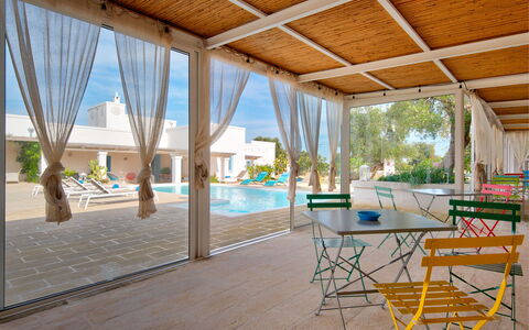 Masseria Tufo Bianco: Table, Furniture, Plant, Chair, Water, Building, Swimming Pool, Shade, Window, Interior Design