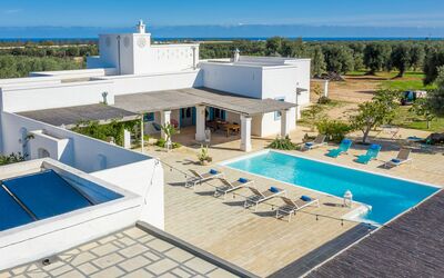 Masseria Tufo Bianco: Building, Sky, Property, Swimming Pool, Water, Azure, Tree, Outdoor Furniture, Shade, Architecture