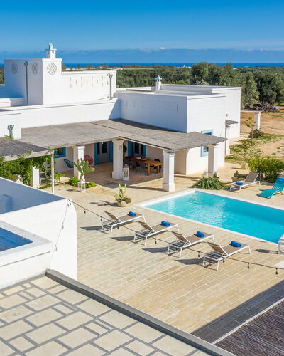 Masseria Tufo Bianco: Building, Sky, Property, Swimming Pool, Water, Azure, Tree, Outdoor Furniture, Shade, Architecture