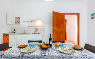 Appartamento Jentu: Cabinetry, Property, Food, Azure, Orange, Interior Design, Countertop, Tableware, Kitchen, Floor