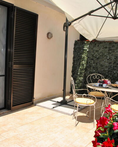 La Terrazza di Dinky: Plant, Flower, Property, Furniture, Building, Flowerpot, Chair, Houseplant, Table, Shade