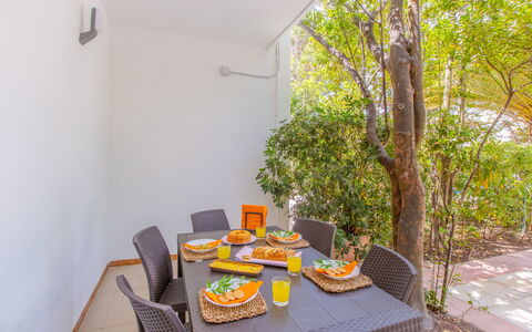 Villa Talise: Table, Furniture, Plant, Chair, Interior Design, Wood, Outdoor Furniture, Floor, Tableware, Building