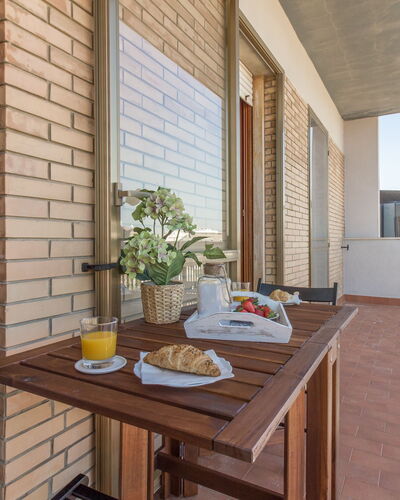 Cattolica Sea Loft: Table, Property, Tableware, Building, Window, Food, Wood, Sky, Interior Design, Shade