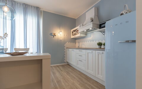 Conero Suite: Cabinetry, Property, Furniture, Countertop, Building, Kitchen, Interior Design, Window, Wood, Architecture