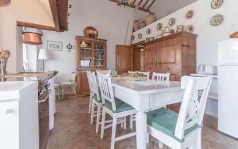 Villa La Picena: Table, Property, Furniture, Cabinetry, Countertop, Wood, Lighting, Chair, Kitchen, Architecture