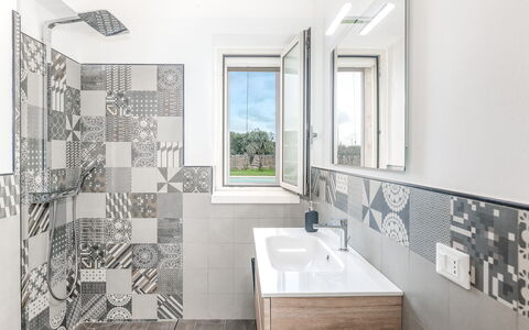 Villa Trullina: Plumbing Fixture, Tap, Property, Mirror, Building, Sink, Window, Cabinetry, Bathroom, Wood