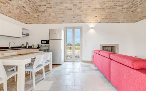 Villa Trullina: Cabinetry, Furniture, Property, Countertop, Table, Interior Design, Wood, Window, Kitchen, Architecture