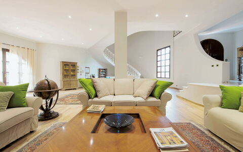 Villa Rossana: Couch, Furniture, Property, Table, Green, Interior Design, Lighting, Living Room, Picture Frame, Studio Couch