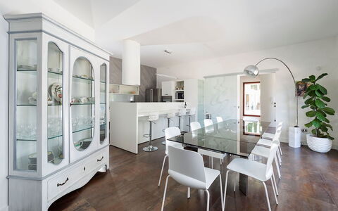 Villa Girgenti: Table, Furniture, Property, Cabinetry, Picture Frame, Houseplant, Shelf, Chair, Building, Flowerpot