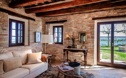 Villa Edelweiss: Brown, Furniture, Building, Window, Property, Couch, Plant, Picture Frame, Azure, Wood