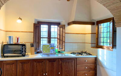 Le Fonti 4: Wall, Kitchen, Wood, Interior Design, Ceiling, Flooring, Kitchen Appliance, Home, Countertop, Major Appliance