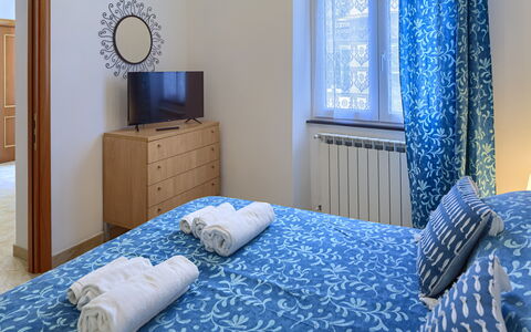 Apartments Mafalda - Levanto: Blue, Furniture, Comfort, Azure, Window, Picture Frame, Textile, Building, Cabinetry, Wood