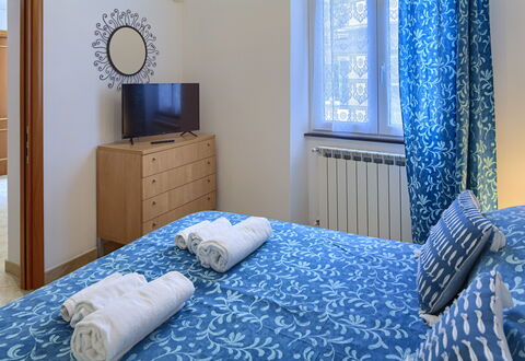Apartments Mafalda - Levanto: Blue, Furniture, Comfort, Azure, Window, Picture Frame, Textile, Building, Cabinetry, Wood