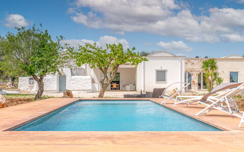Bianco Trullo: Cloud, Sky, Property, Plant, Water, Swimming Pool, Building, Azure, Shade, Tree