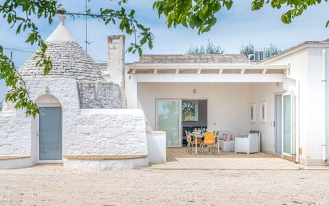 Bianco Trullo: Sky, Property, Plant, Building, Land Lot, Shade, Wall, Tree, Real Estate, Landscape