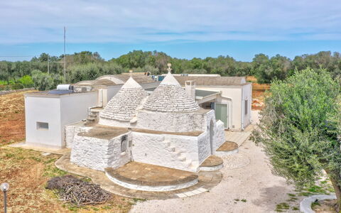 Bianco Trullo: Sky, Plant, Cloud, Building, Tree, House, Land Lot, Urban Design, Landscape, Facade