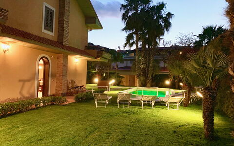 Villa Tricca: Plant, Sky, Building, Property, Window, Green, Tree, House, Grass, Arecales