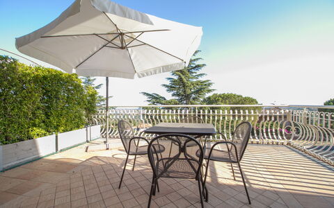 Etna Suites: Sky, Table, Furniture, Building, Plant, Umbrella, Shade, Chair, Outdoor Furniture, Outdoor Table