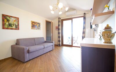 Suite Mansarda: Furniture, Property, Couch, Picture Frame, Cabinetry, Wood, Lighting, Interior Design, Comfort, Living Room