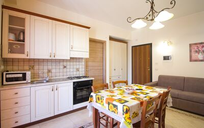 Suite Trilocale 1: Cabinetry, Property, Countertop, Furniture, White, Table, Wood, Lighting, Interior Design, Flooring