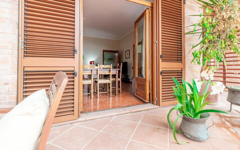Villa Rosso Corbezzolo: Plant, Property, Furniture, Wood, Houseplant, Lighting, Building, Flooring, Architecture, Flowerpot