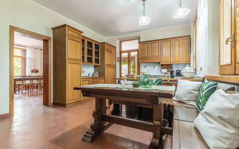 Villa Rosso Corbezzolo: Table, Furniture, Building, Wood, Cabinetry, Interior Design, Living Room, Chair, House, Countertop