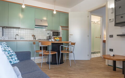 Fano Lighthouse: Table, Property, Building, Furniture, Cabinetry, Shelving, Interior Design, Shelf, Wood, Bookcase