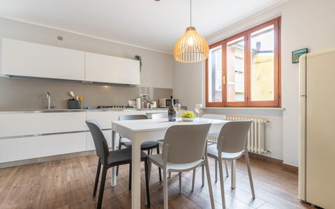 Casa Del Porto: Furniture, Table, Countertop, Cabinetry, Chair, Wood, Kitchen, Interior Design, Flooring, Window