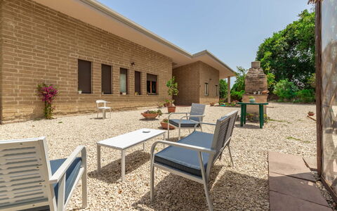 Villa Elpidio: Plant, Property, Sky, Furniture, Building, Shade, Tree, Outdoor Furniture, Residential Area, Public Space