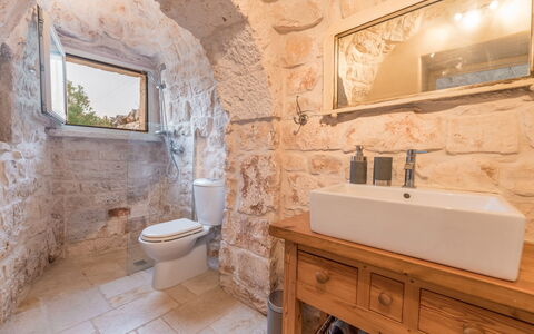 Trullo Ulivo: Brown, Mirror, Property, Tap, Plumbing Fixture, Bathroom Cabinet, Sink, Bathroom, Bathroom Sink, Building